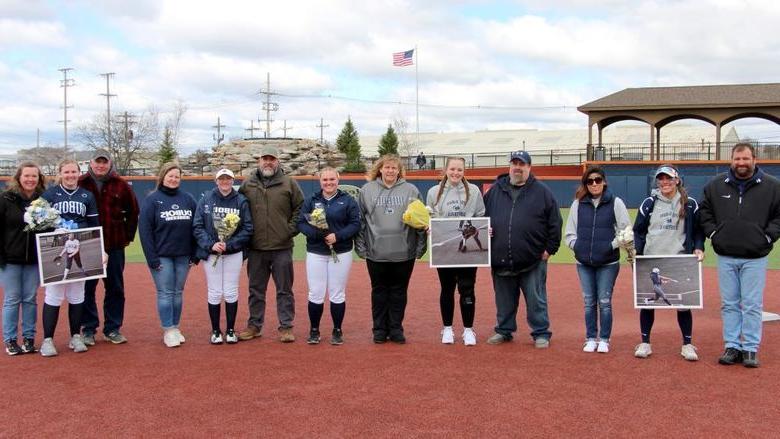 The members of the softball team at Penn State DuBois who were recognized, along with their family members, during senior day recognition.