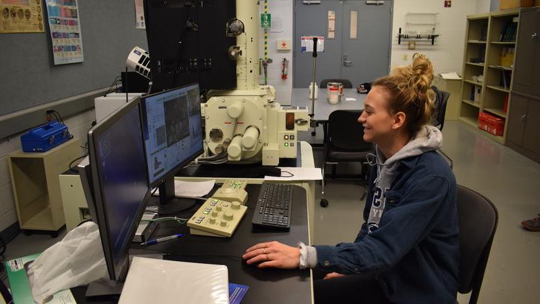 Penn State DuBois Engineering Student Nicolette Brossard examines properties of powder metal material under a scanning electronic microscope. 